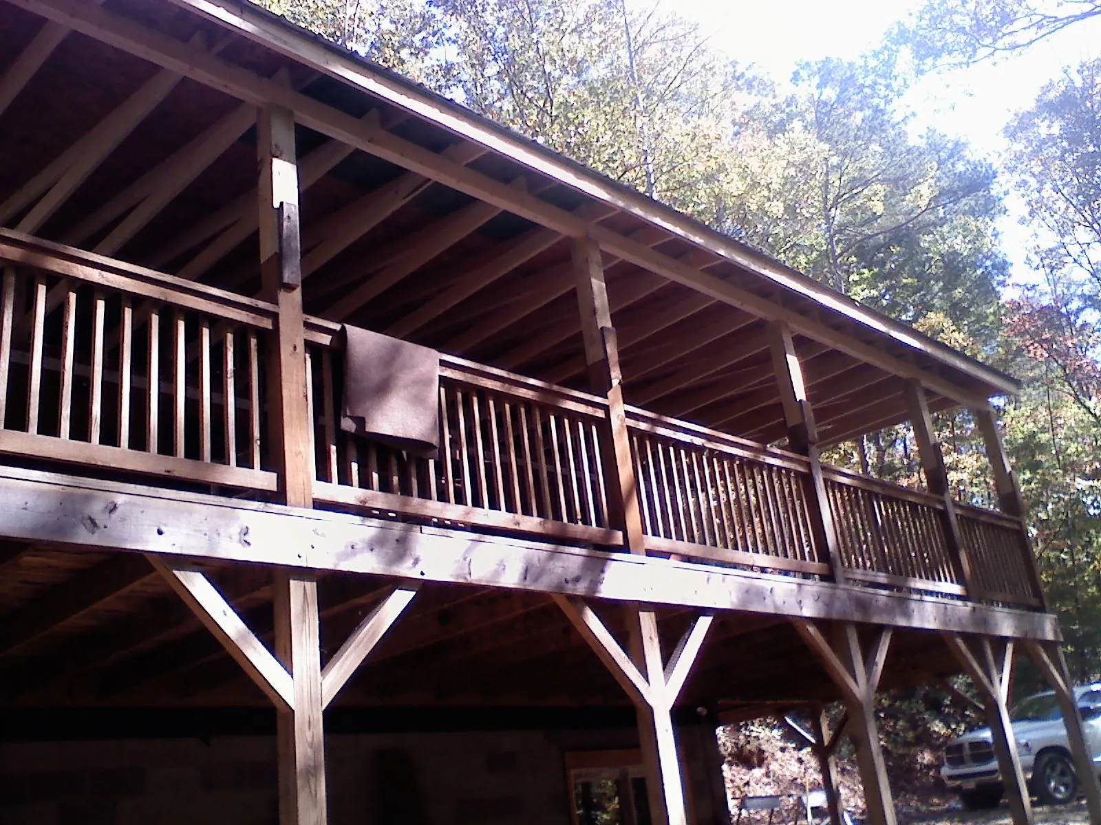 Timber framing under a new elevated porch and deck — Roof Leak Repair in West Fork by Roofing Brothers